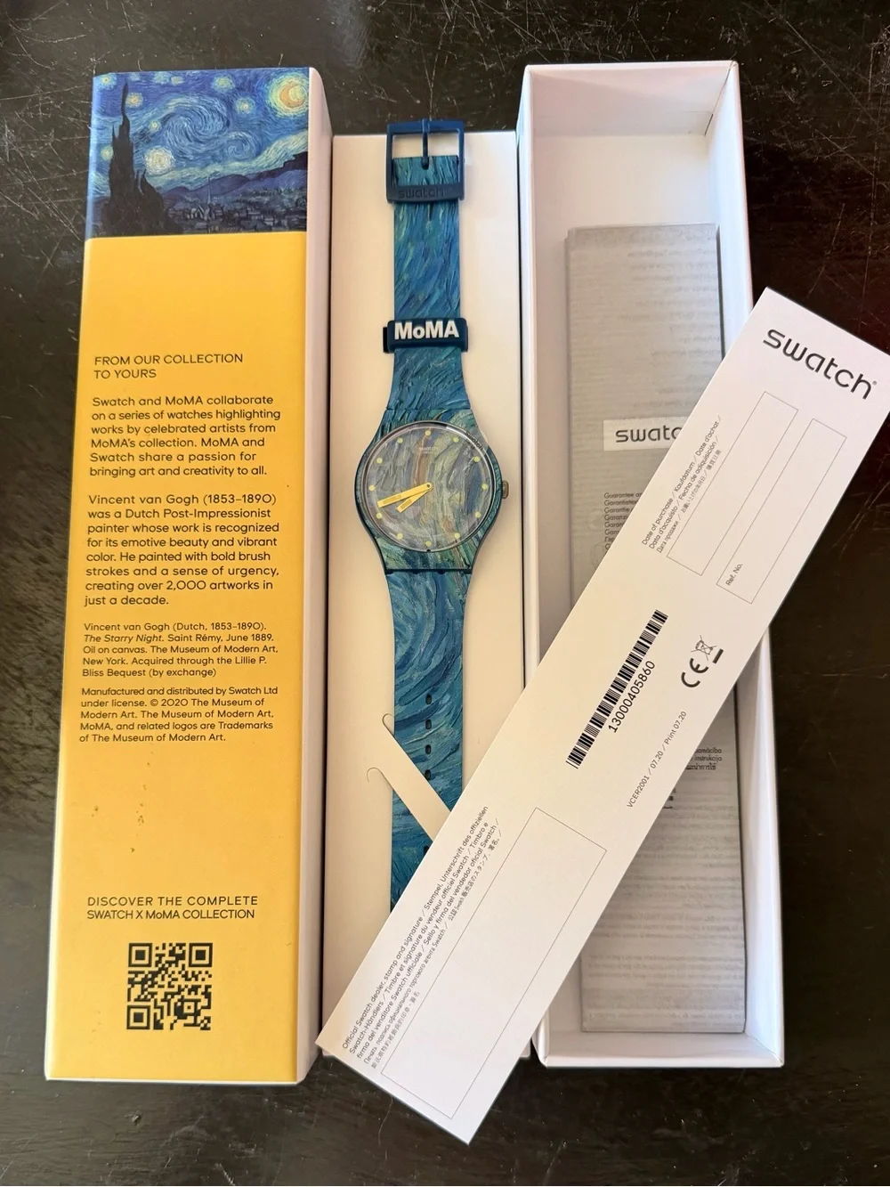 Swatch blue marbled dial and strap watch with yellow hands